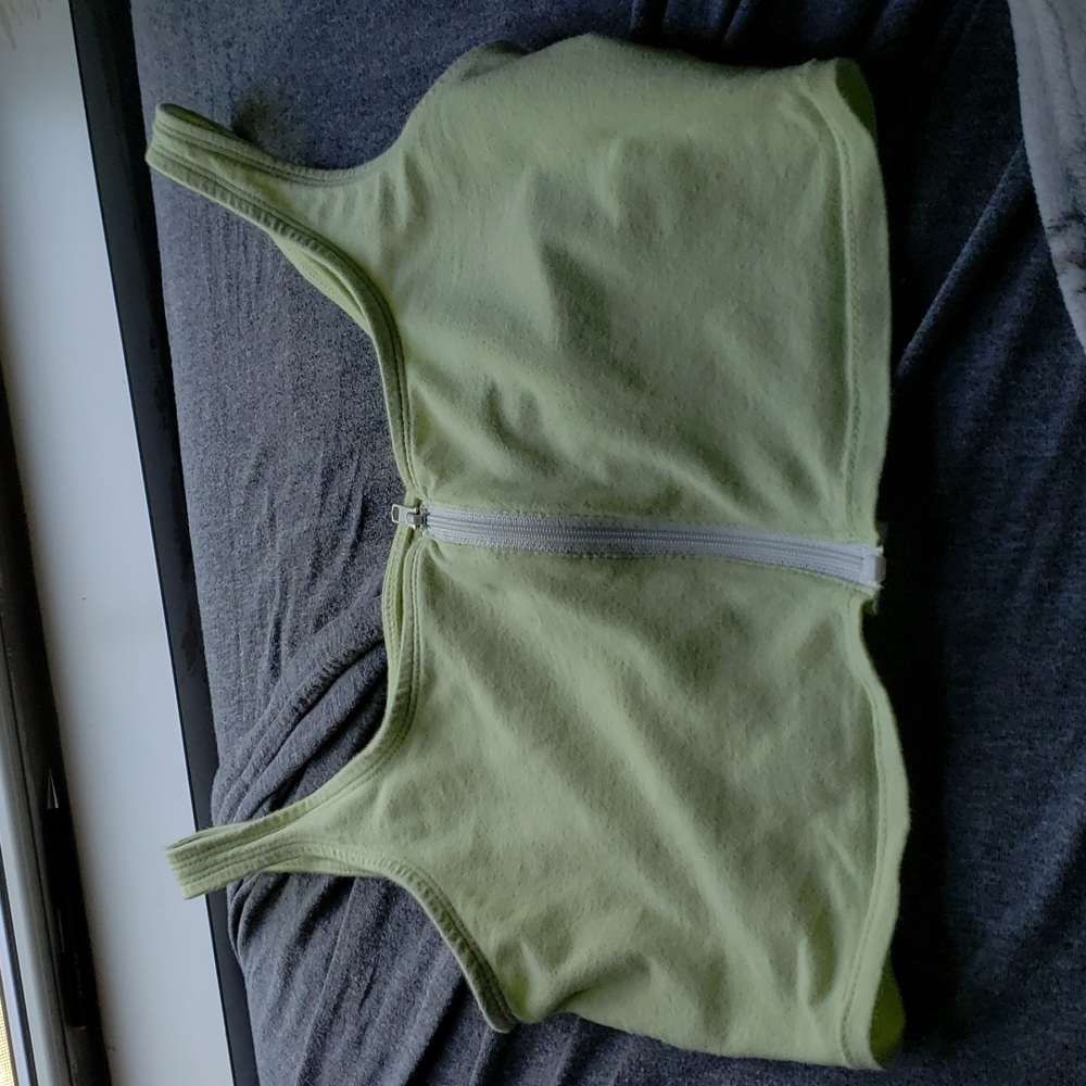 Small, green Me to We zipper crop top
